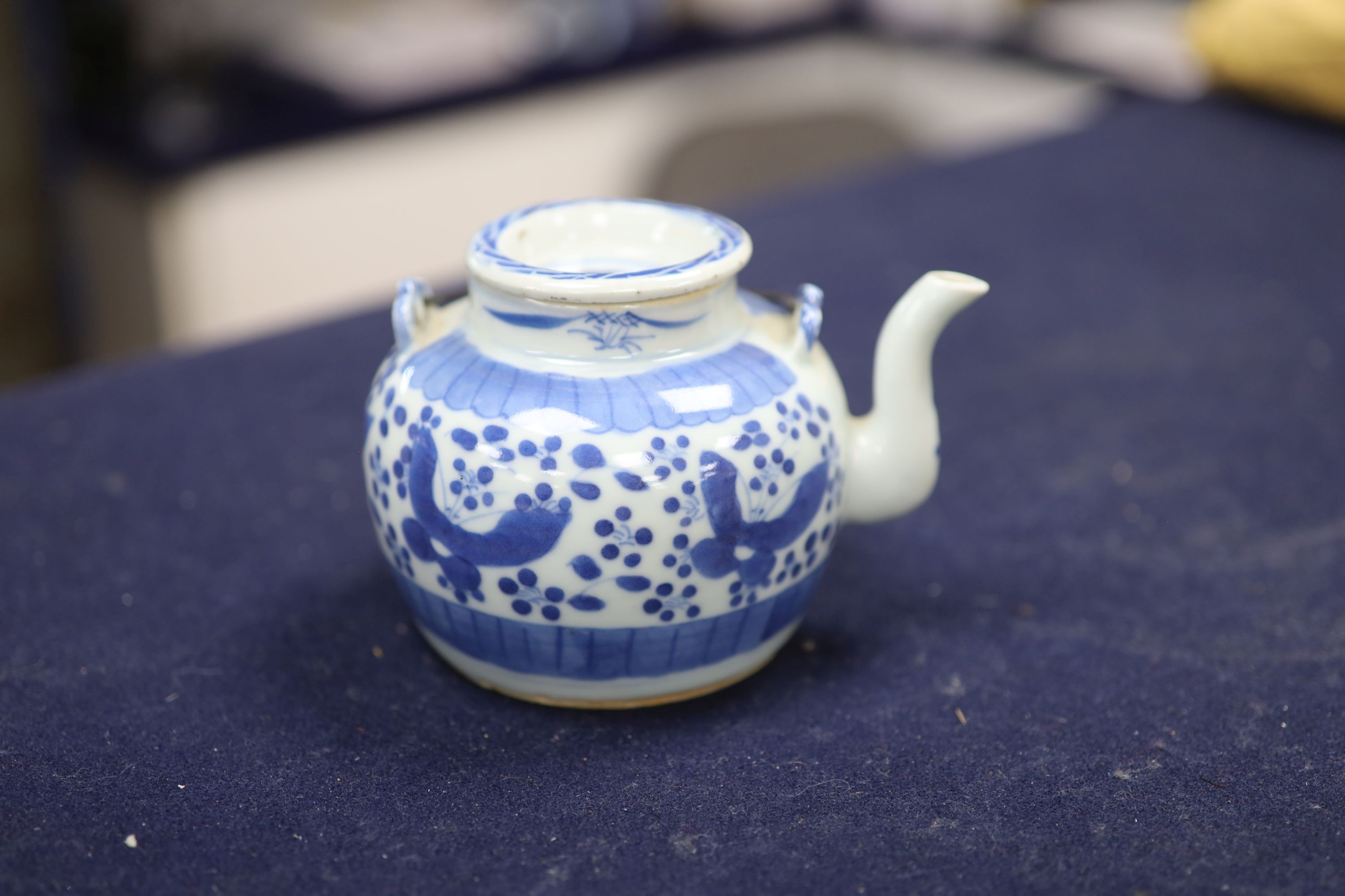 Two 19th century Chinese blue and white moon flasks and a teapot, tallest 21cm